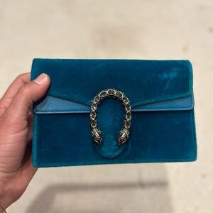 Teal velvet Gucci Dionysus purse. Missing one stone. Good condition